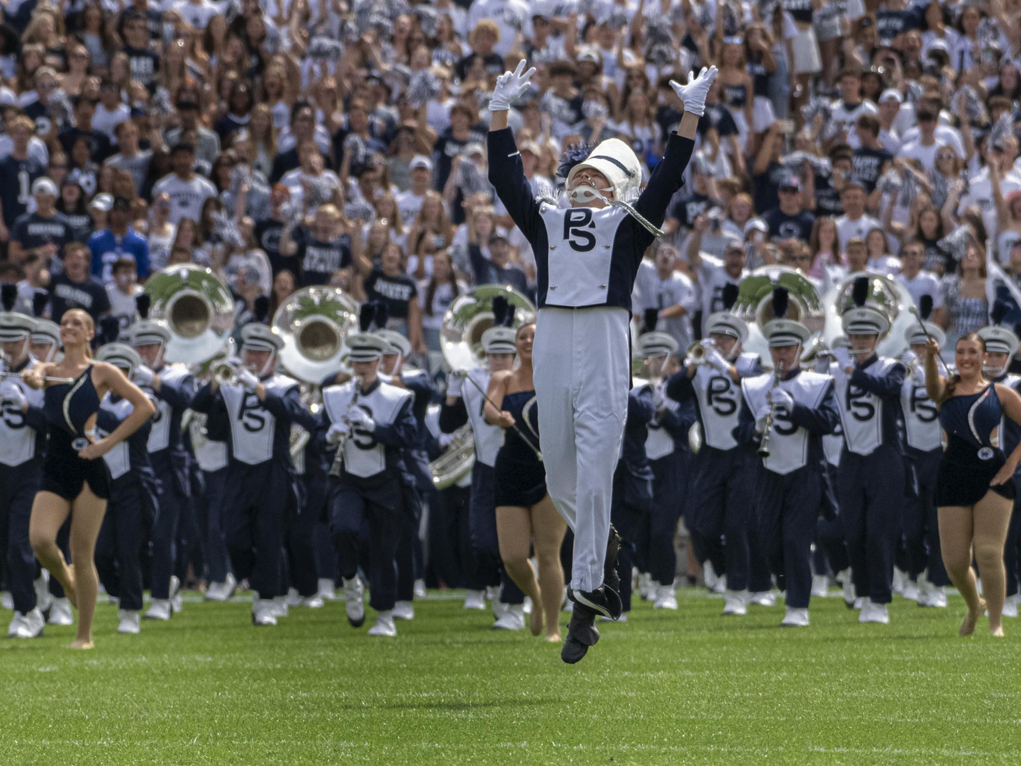 drum major leads blue band onto field