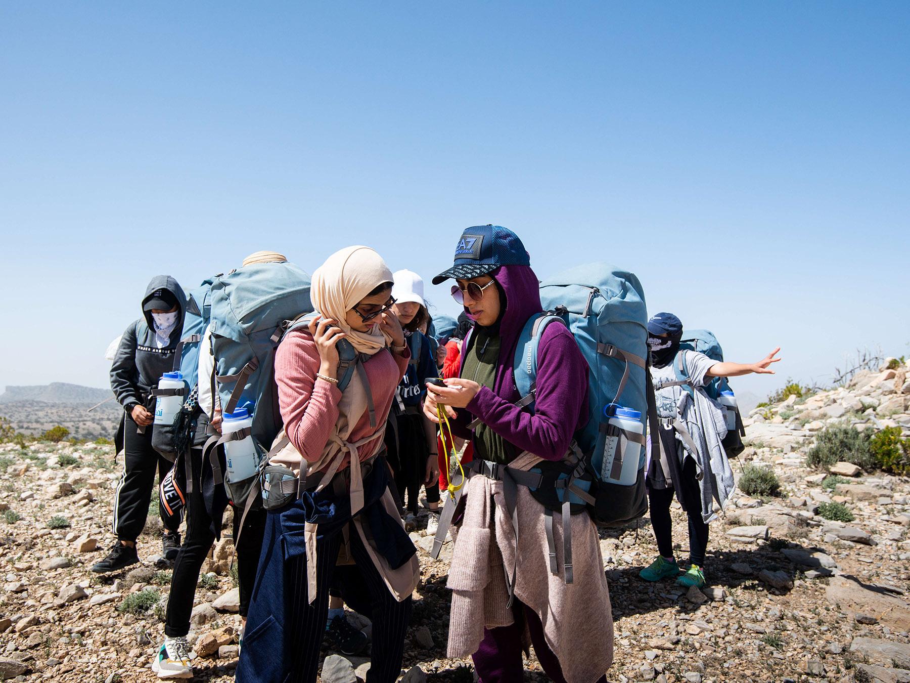Several Outward Bound students in Oman wearing backpacks