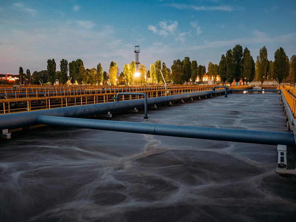 Modern wastewater treatment plant. Tanks for aeration and biological purification of sewage at sunset.