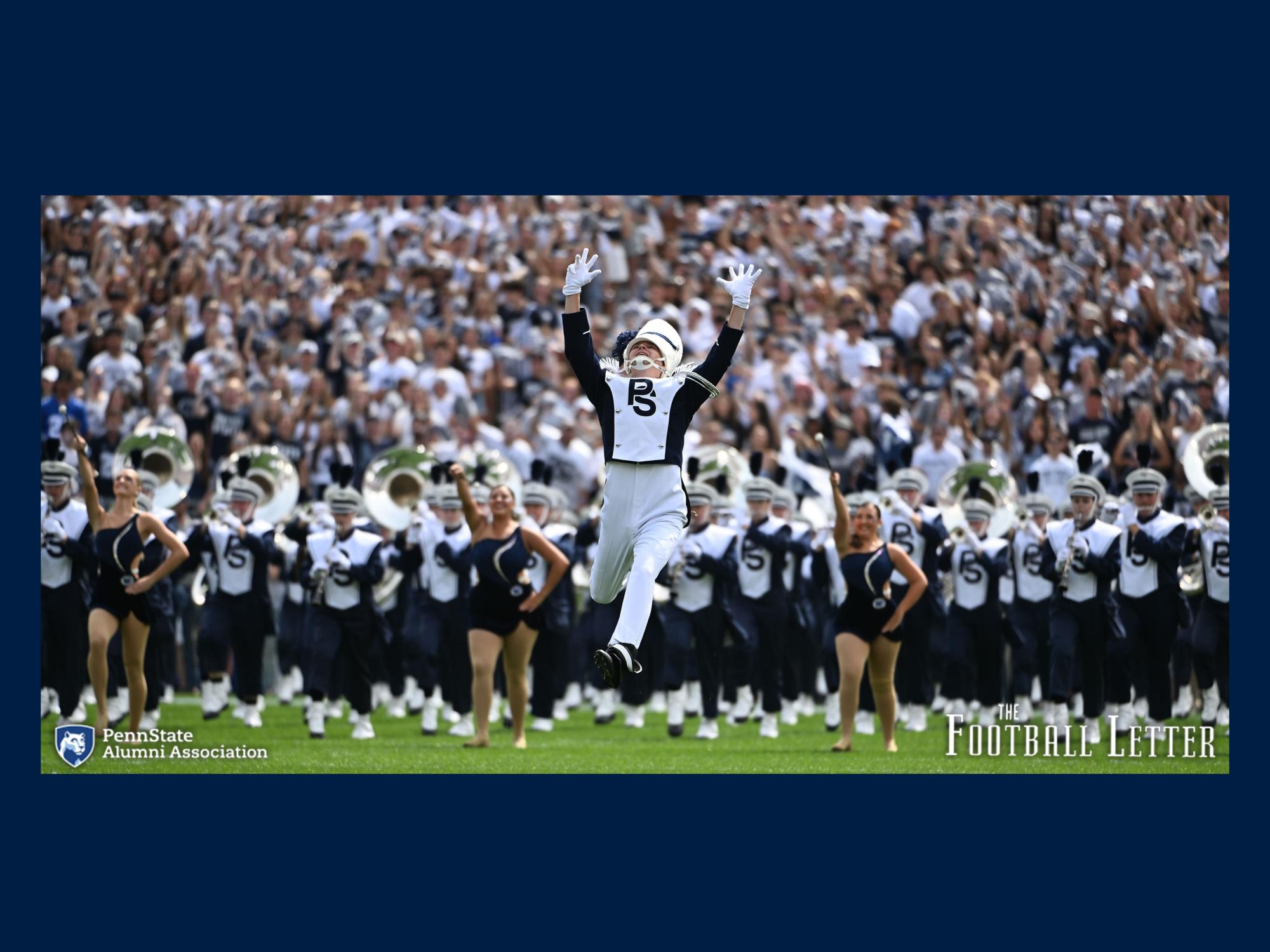 members of the Blue Band, a marching band, and twirlers all take to the field during a football game.