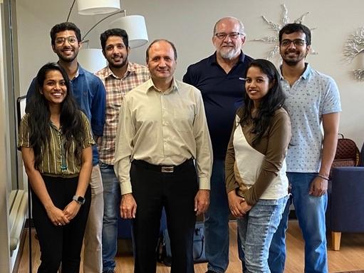 A group of people smiling