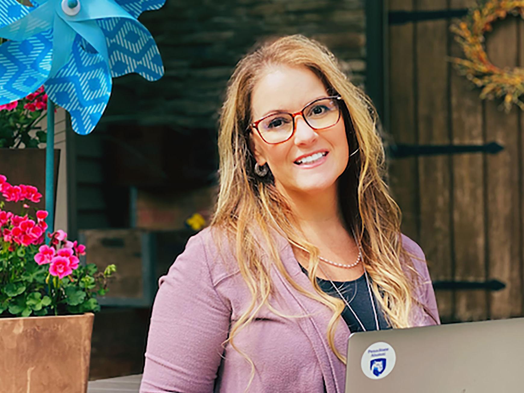 Malena Gittler sits in front of a laptop