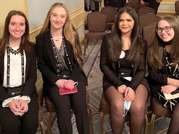 McCauley and her student partners presenting findings from an earlier version of their project at the American Society of Criminology conference in Chicago in Nov. 2021.