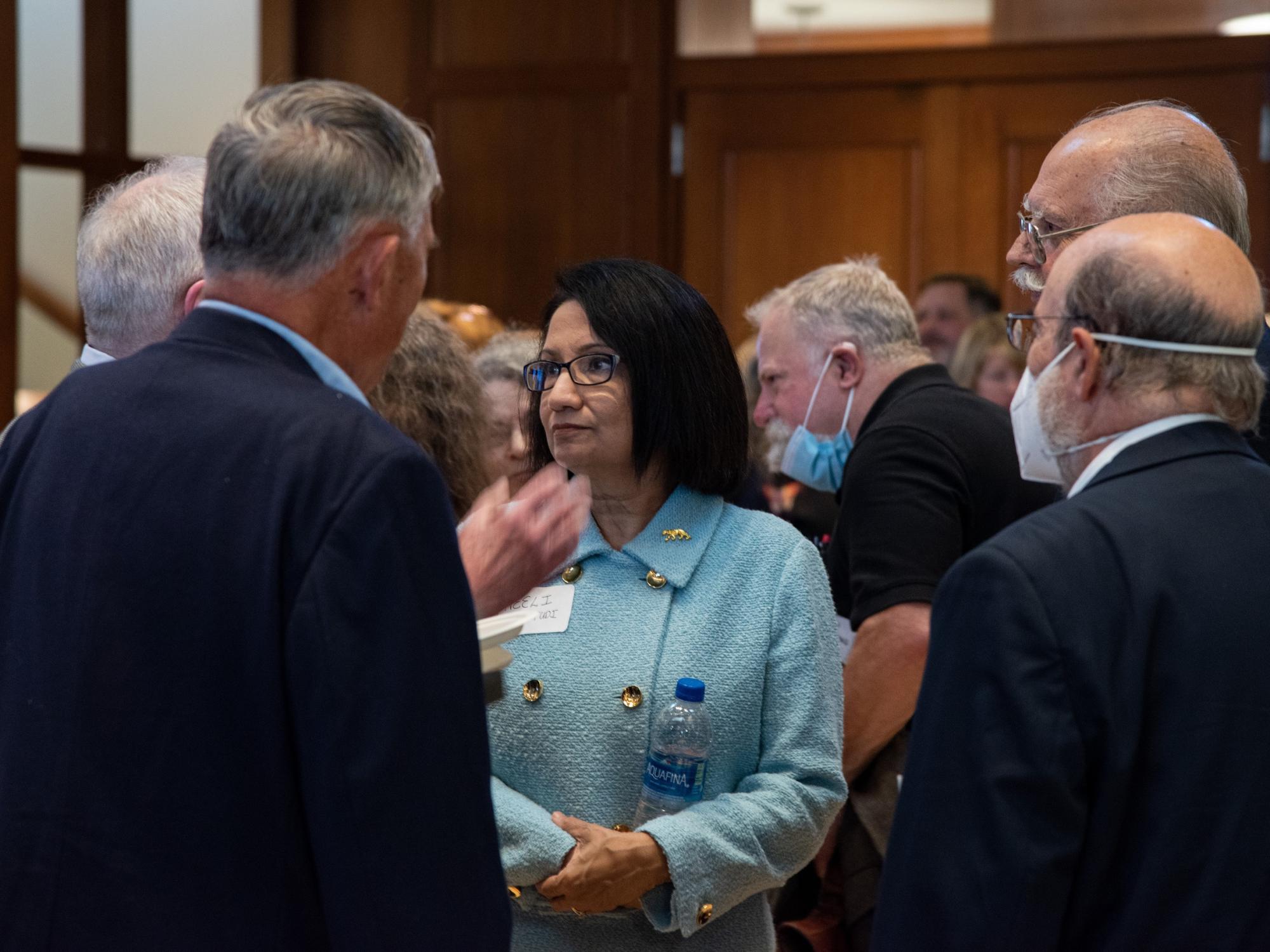 Penn State President Neeli Bendapudi talks with members of the Penn State Faculty Senate at a reception held on Sept. 12.
