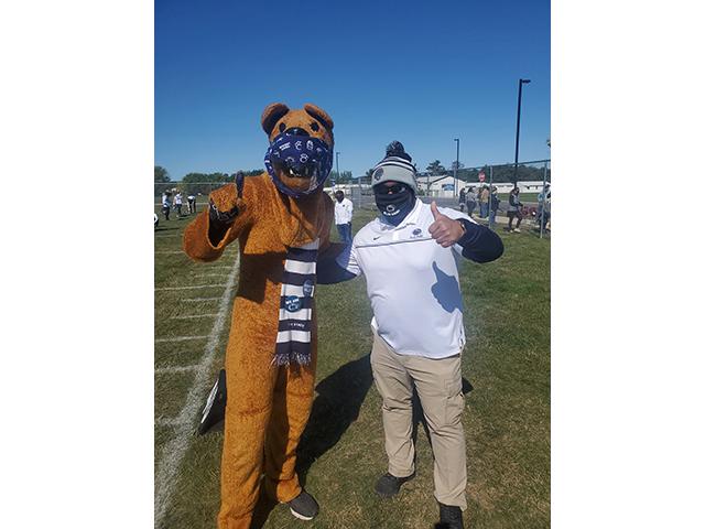 Maj. Phillip Ealy poses with the Nittany Lion mascot