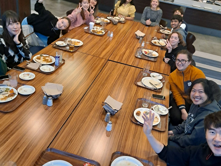 A group of international students around a table