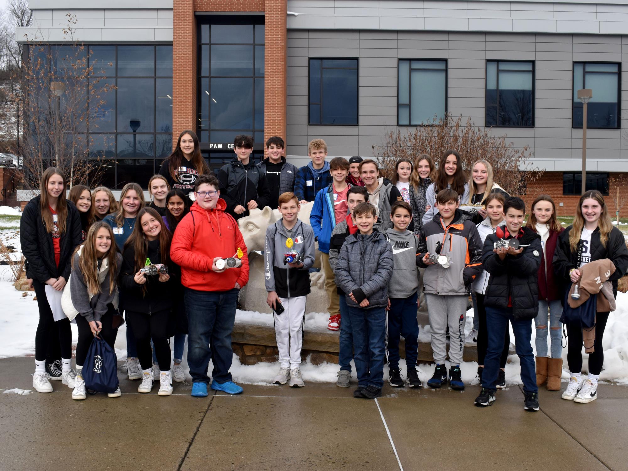 Students gather around the Nittany Lion shire prior to racing their vehicles in the PAW Center