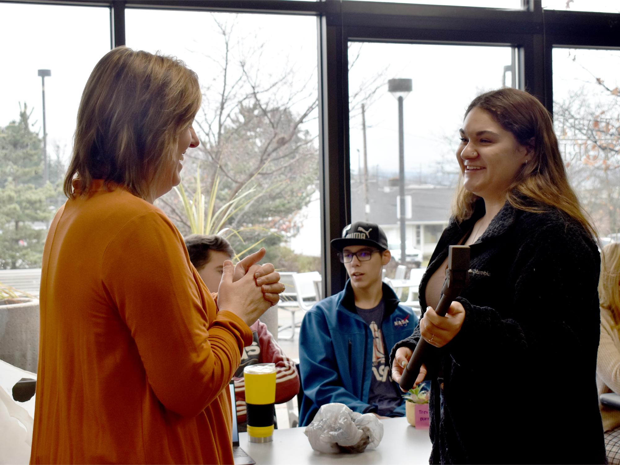 Dakota Hetrick, sophomore OTA student shares information about her group’s idea and demonstrates the usage with her prototype.