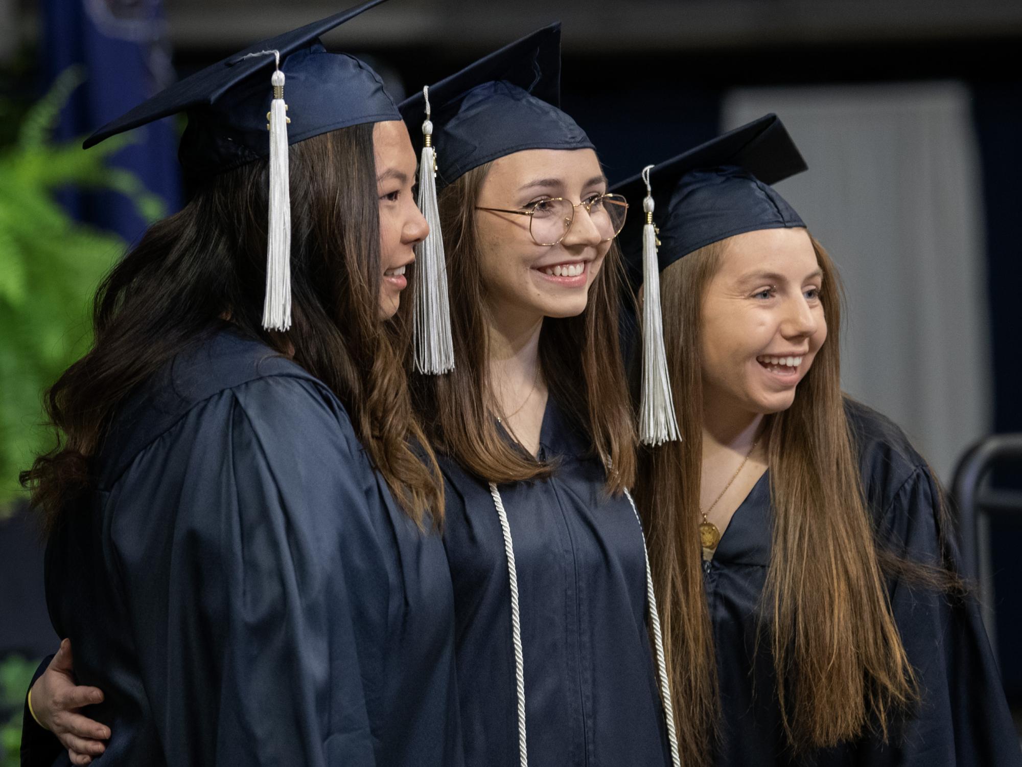 graduates posing for a photo