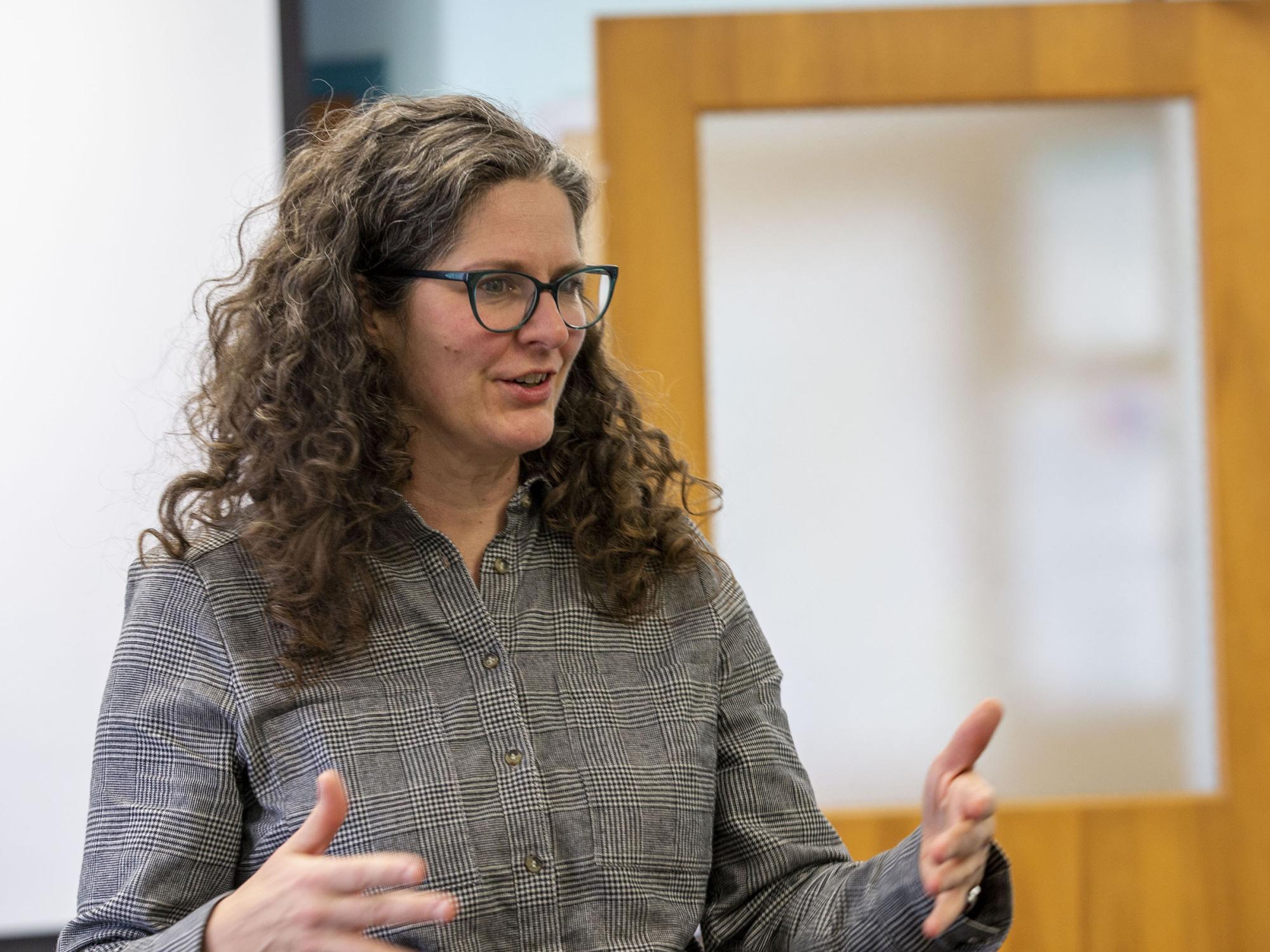 Debbie Hawhee stands at the front of the classroom in her climate rhetoric class on Dec. 5.
