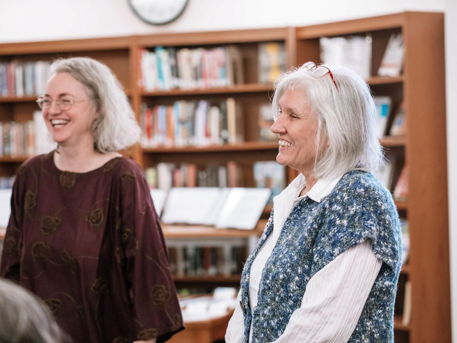 Two women smile