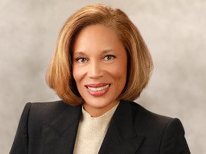 A portrait of Thandi Clements in a suit