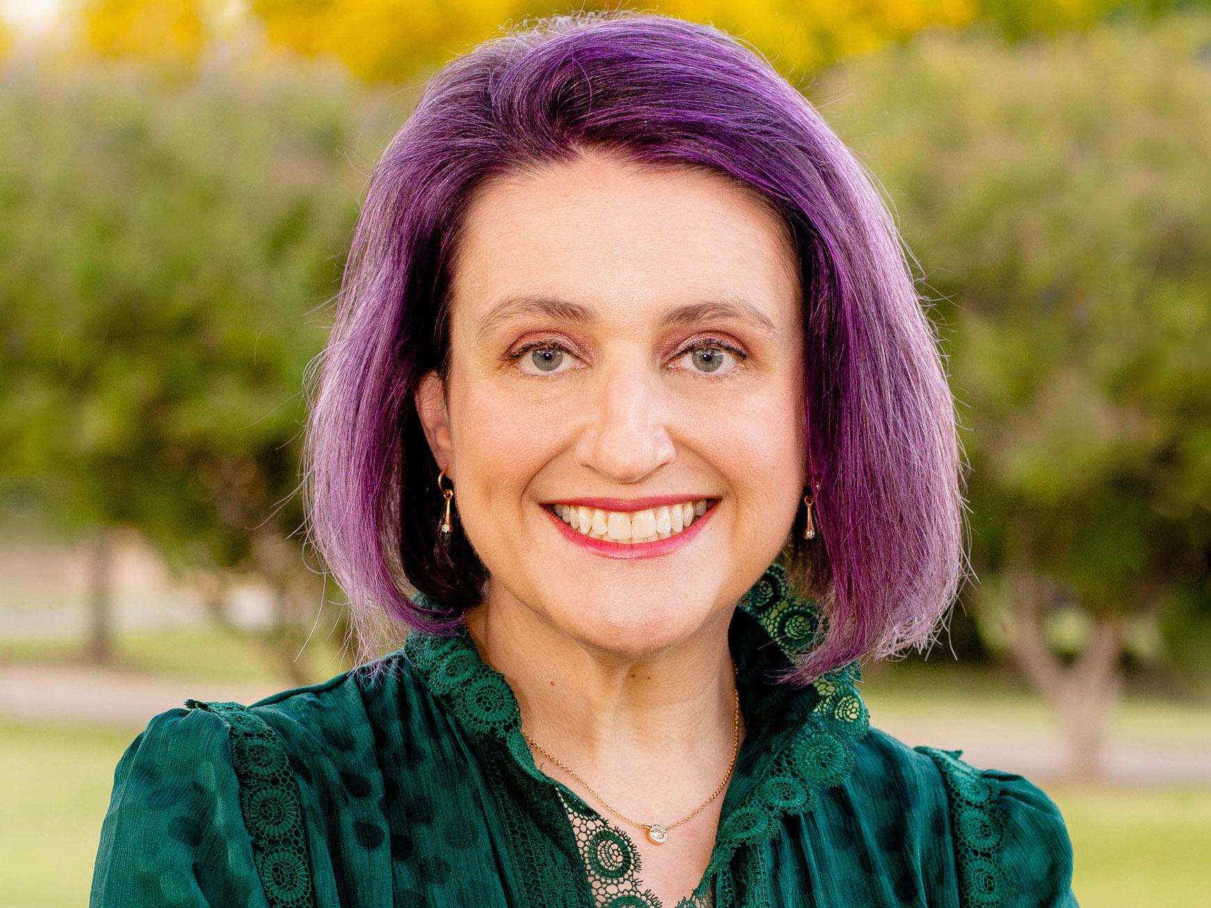 Jennifer Zeares with trees in the background