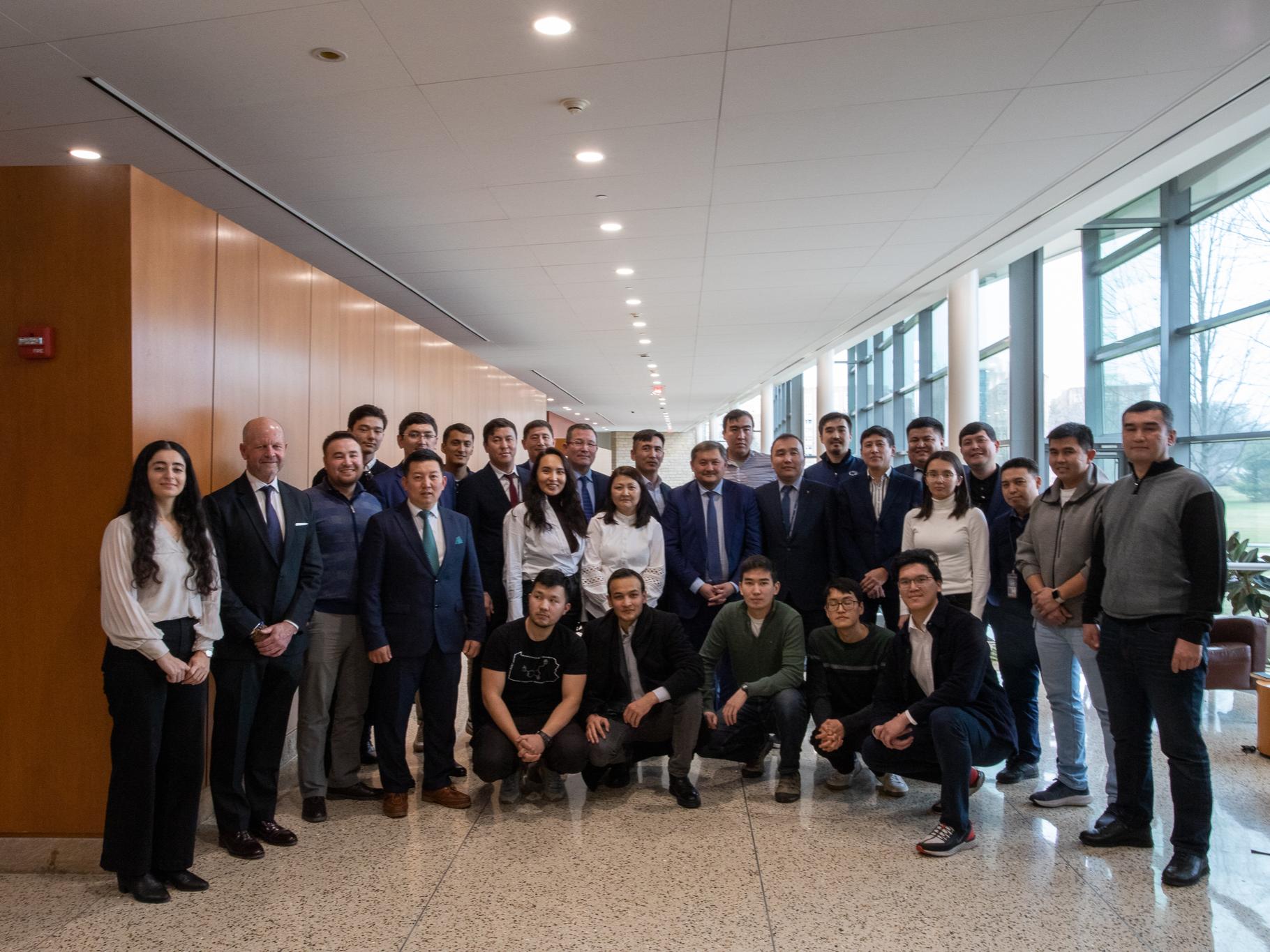 Kazakhstan delegation with Kazakh students attending Penn State in Katz lobby.