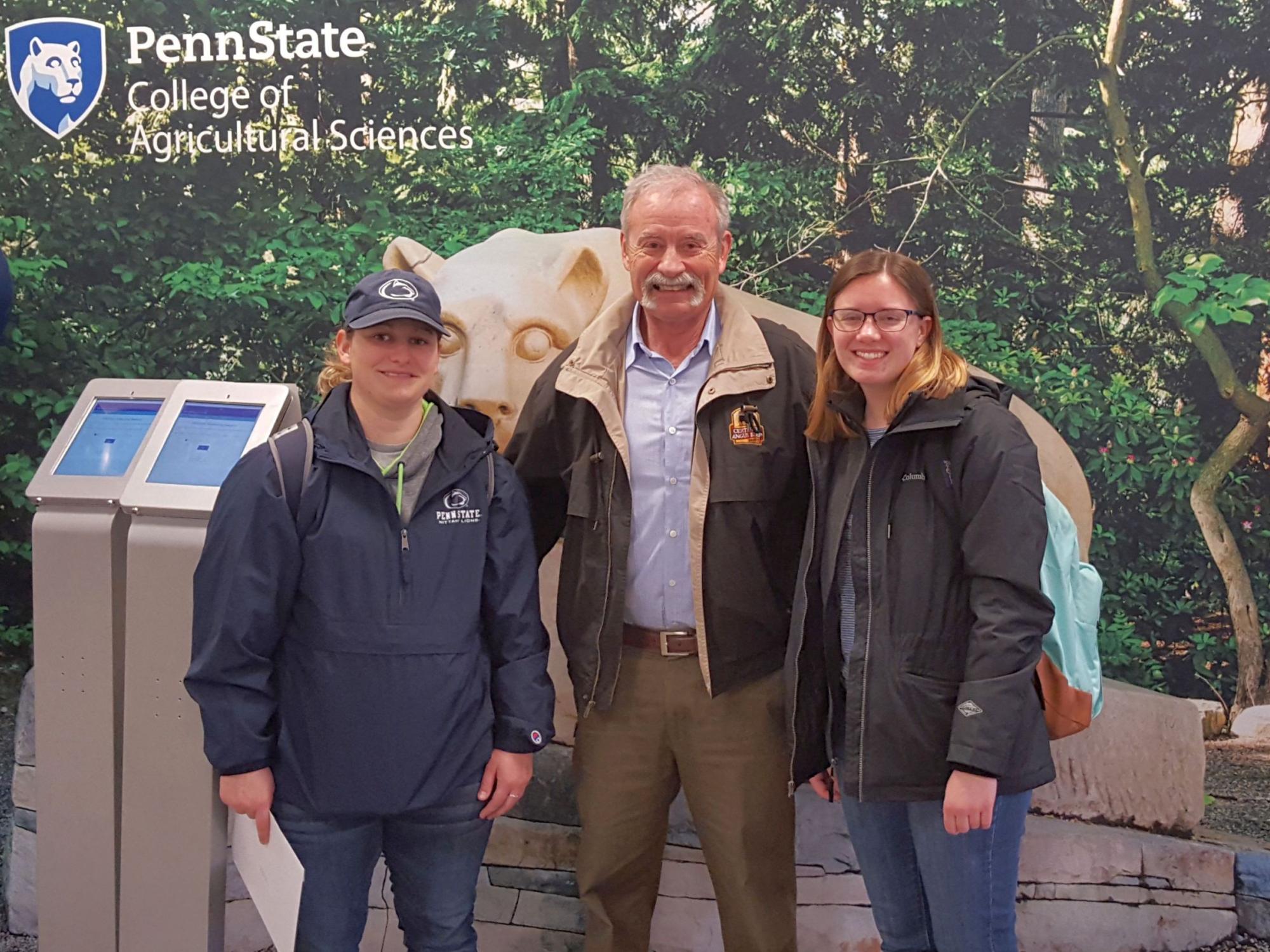 Steve Loerch poses with students