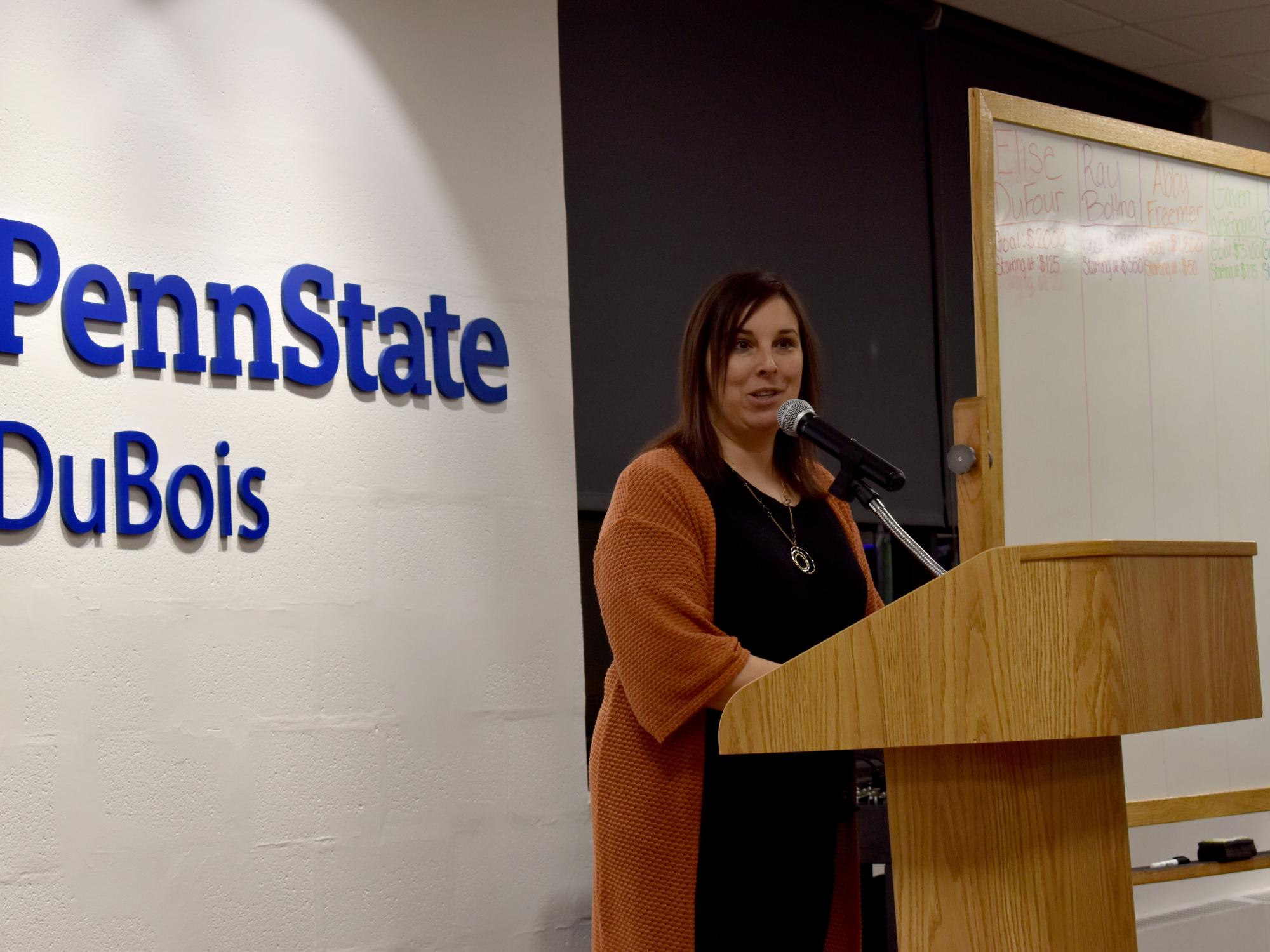 Rebecca Pennington, director of student affairs, gives the opening address at the THON hair auction.