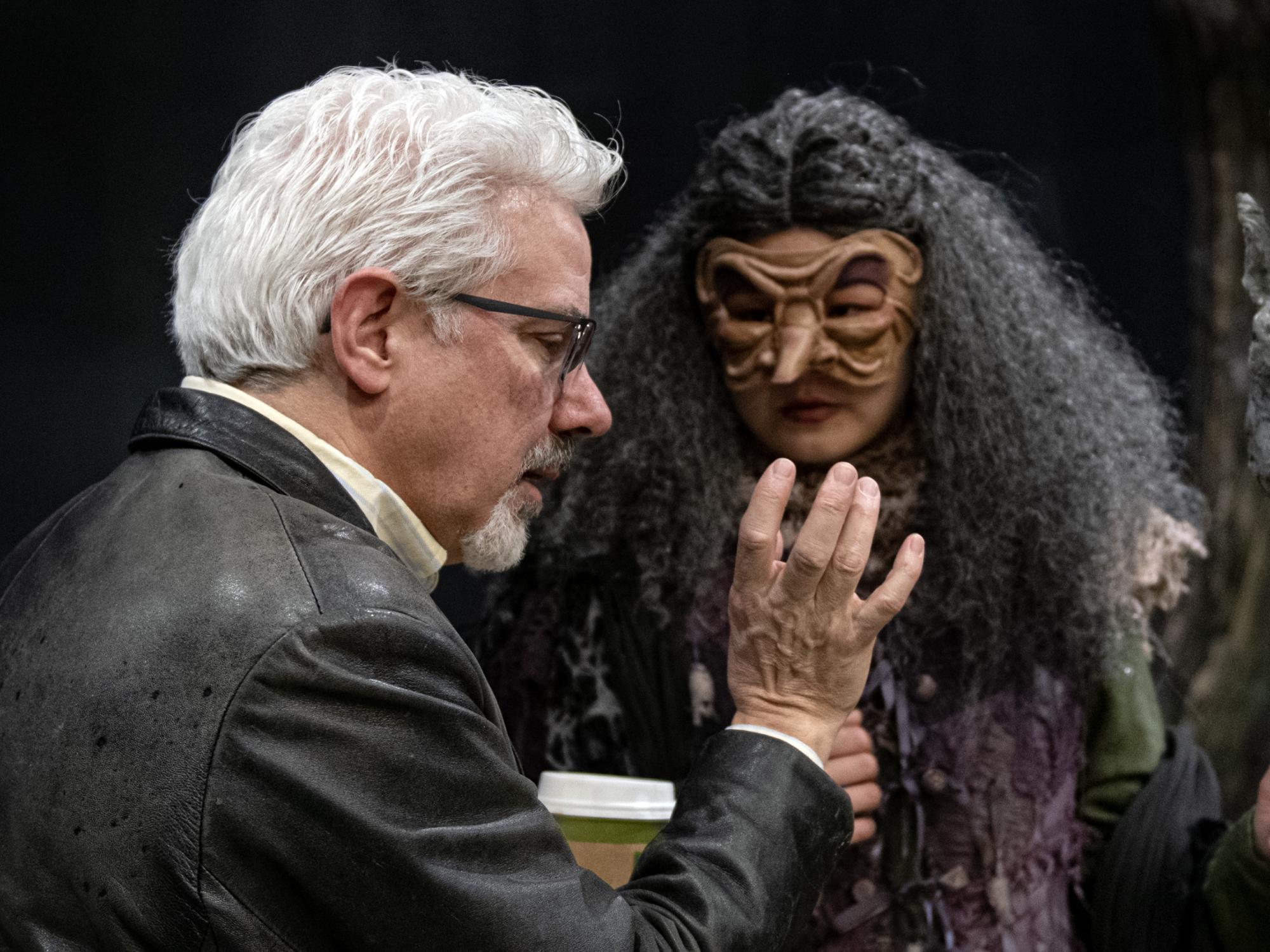 Rick Lombardo directs an actor dressed as a witch