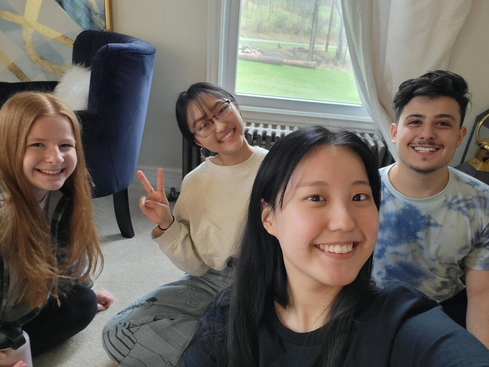 Cindy Choe takes a selfie with three other Centre Helps volunteers.