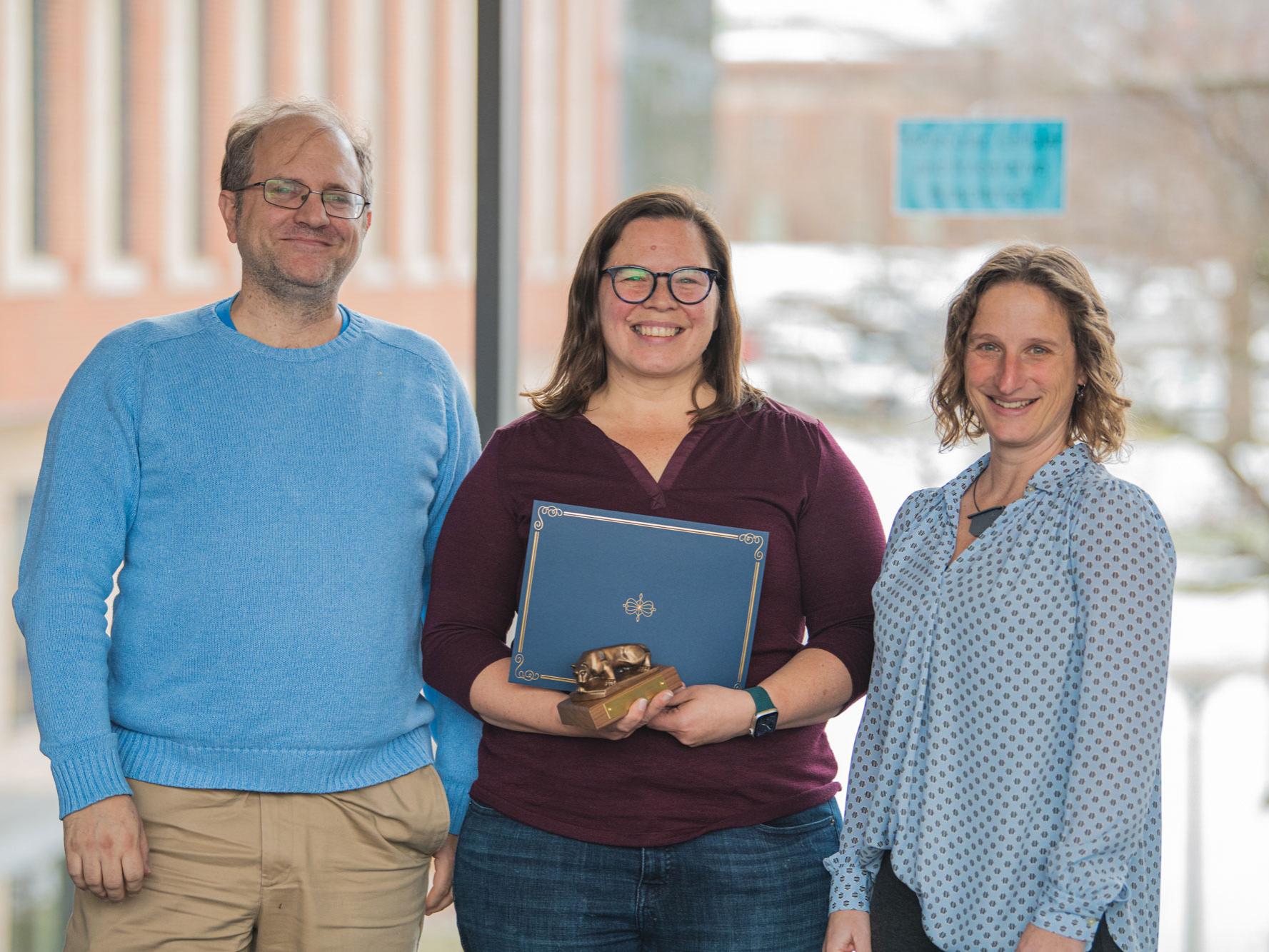 Wissel stands with nominator and dean