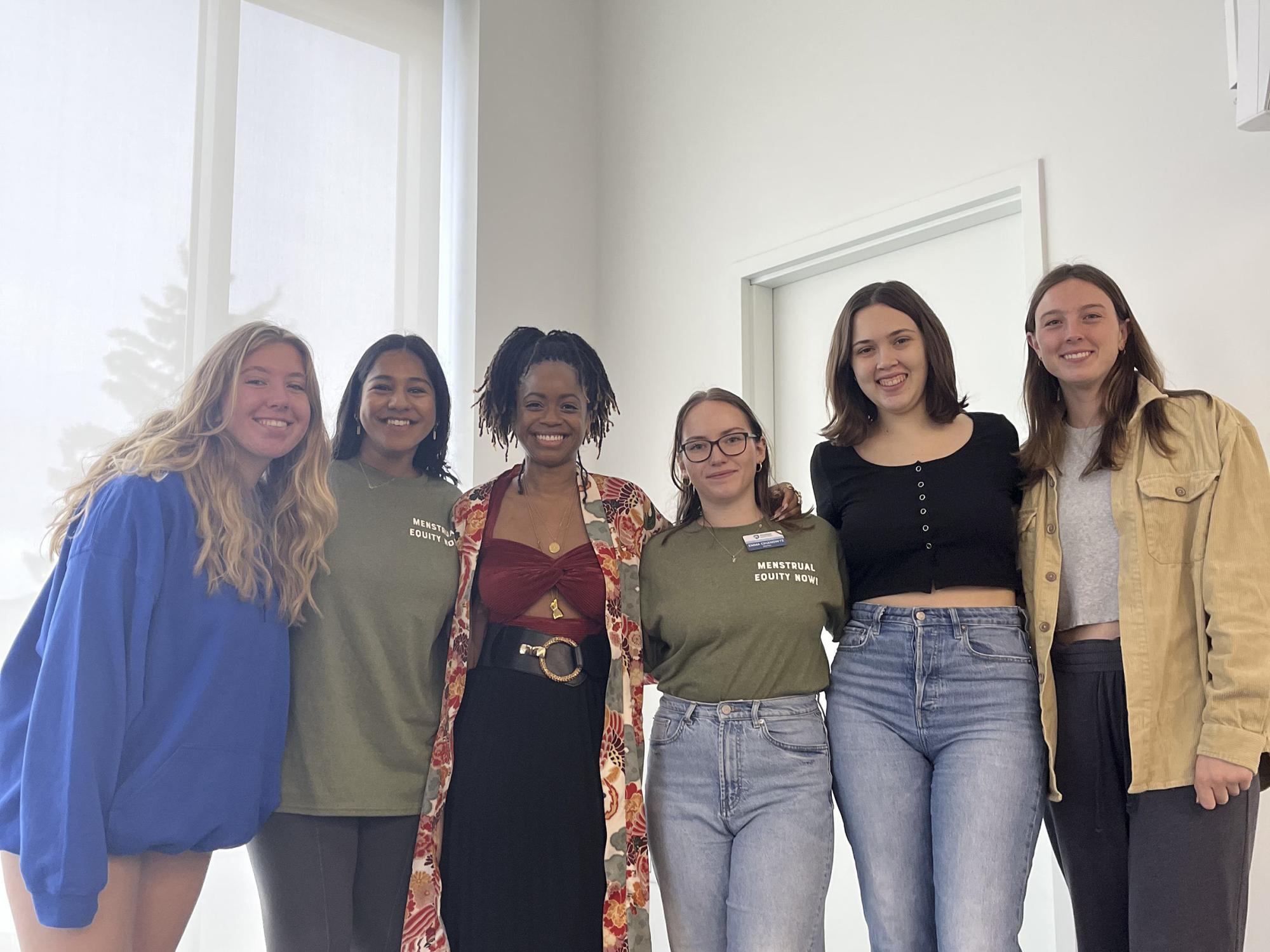 Members of the Days for Girls executive board pose with philanthropist and menstrual freedom activist Chelsea VonChaz (third from left) for a photo during a menstrual equity event in the fall of 2022.