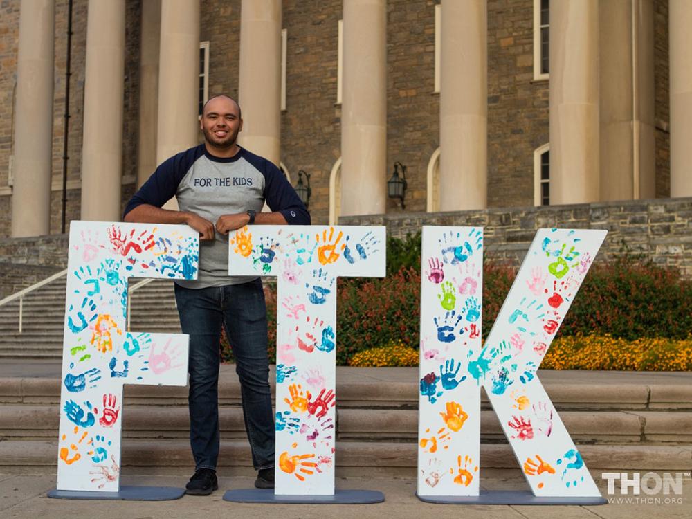 Tyler Saiers, the rules and regulations event safety director for THON 2023, stands in front of Old Main.