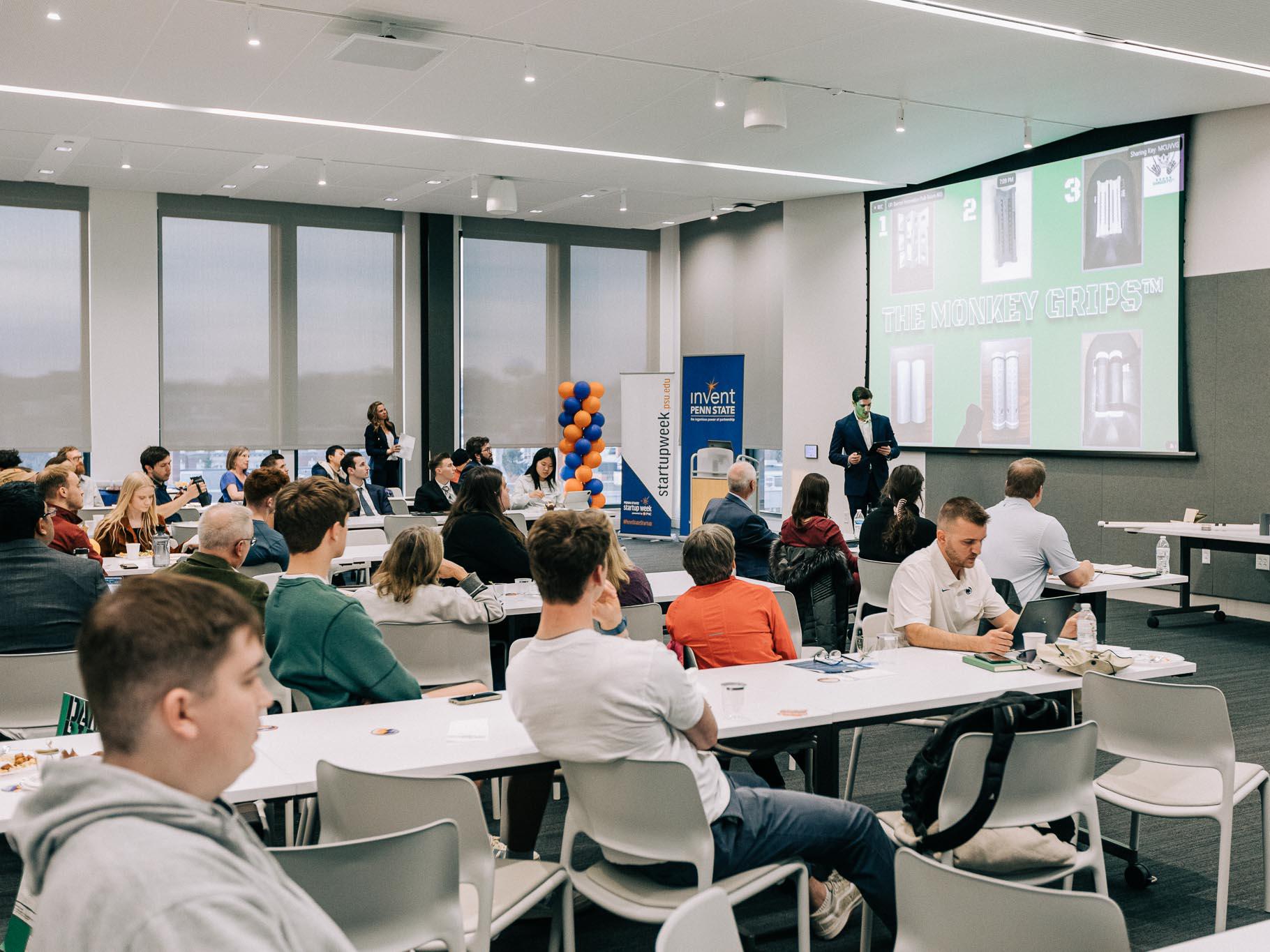 Founders presenting startup to crowd