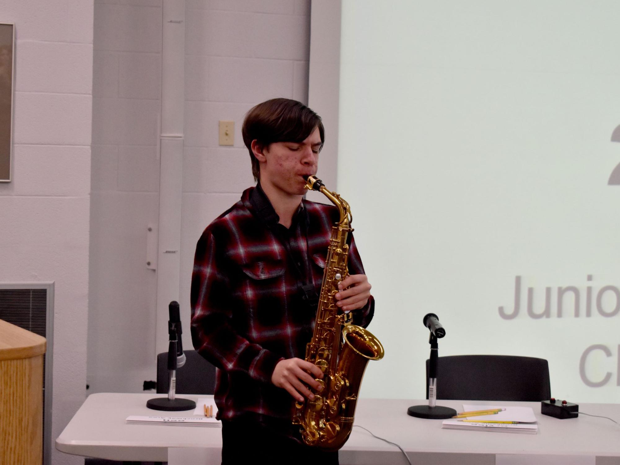 DuBois Area Middle School student Ian Jay plays the national anthem on his saxophone at the start of the junior scholastic challenge