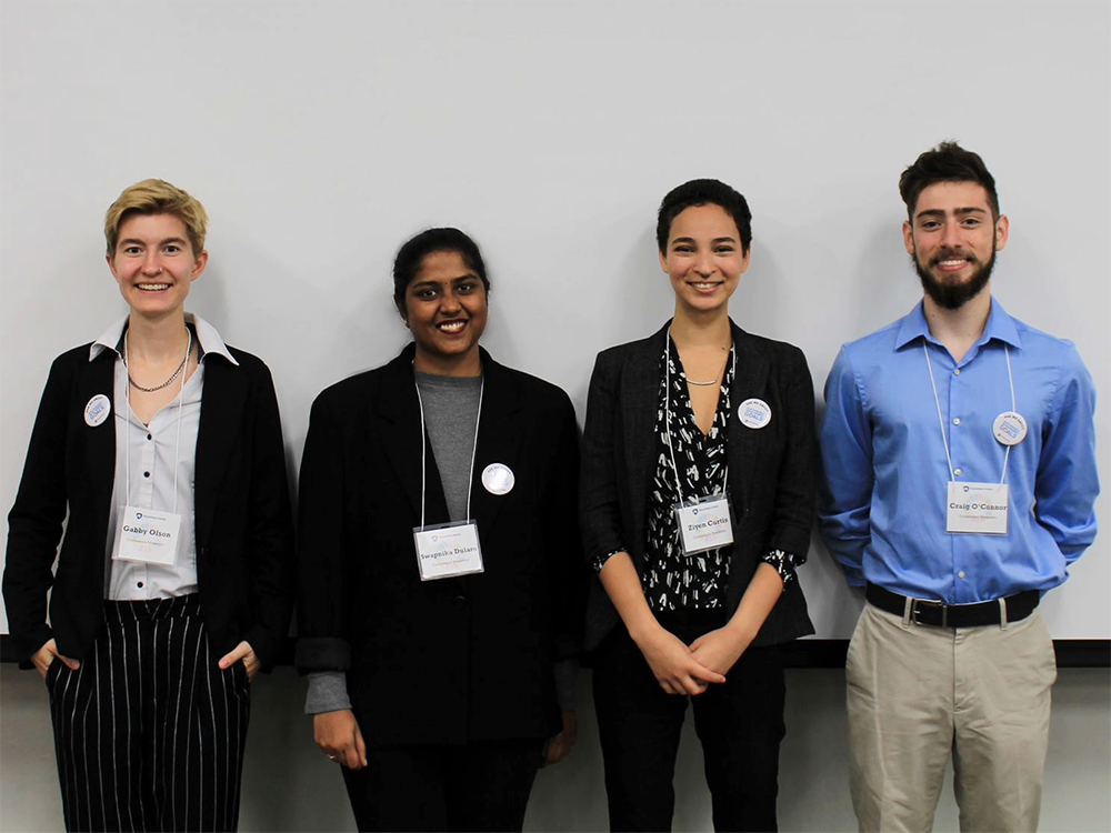 Four Enactus members at the “Global Sustainable Action: It Starts With Us” conference last fall.
