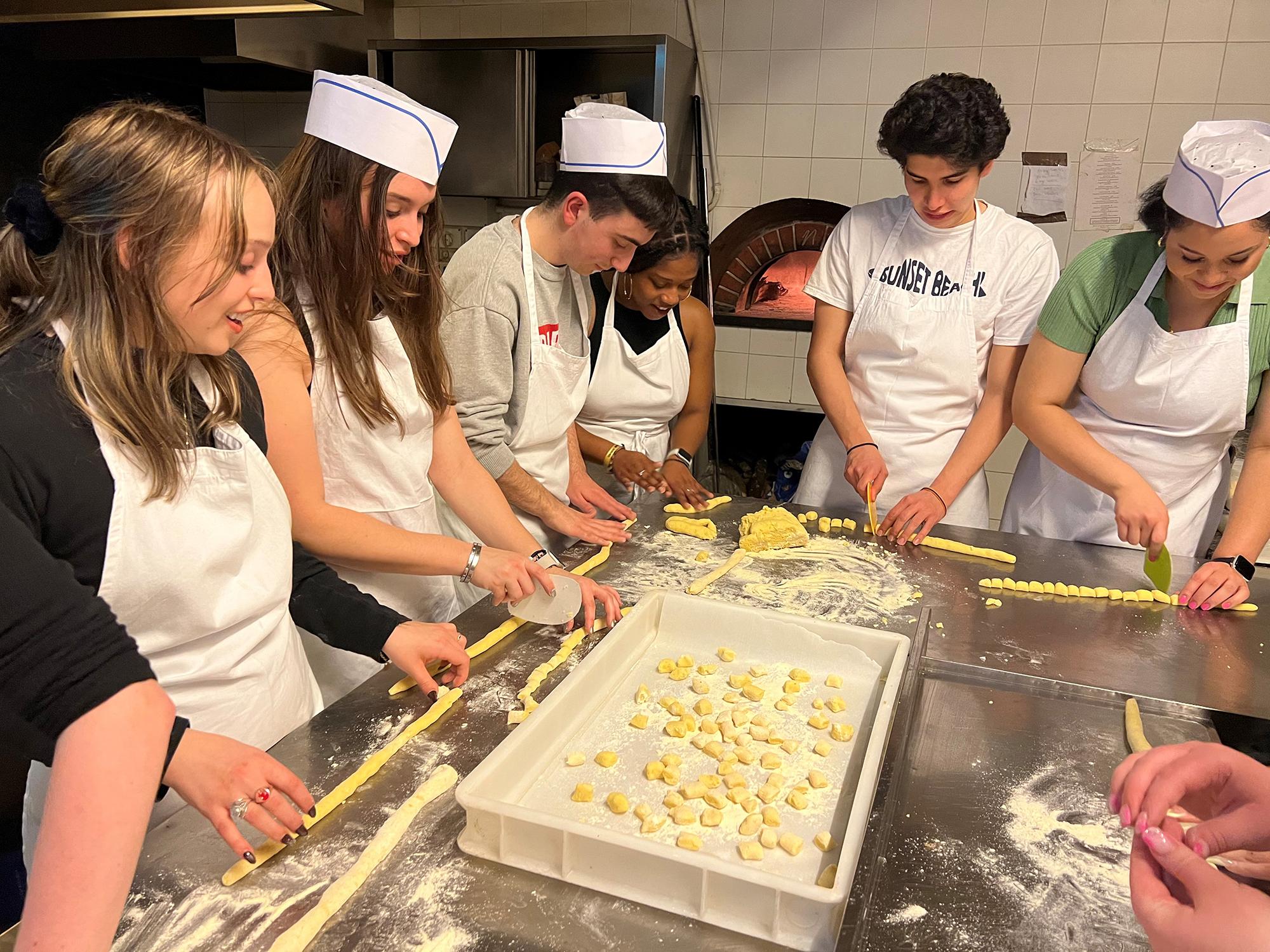Students learned to make gnocchi, pesto and eggplant parmigiano for their farewell dinner.  