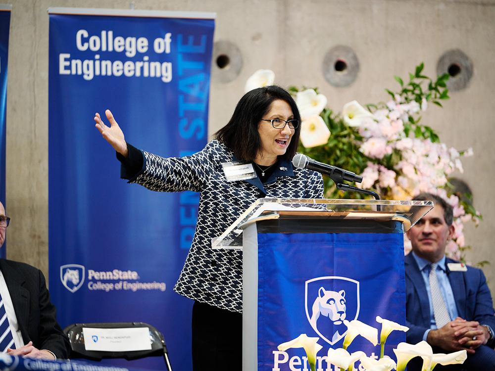 person speaking at a podium