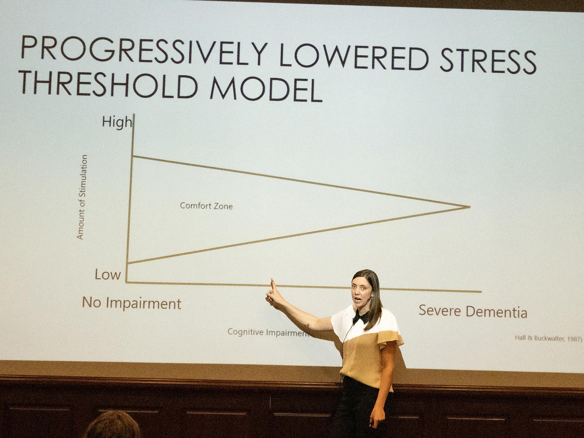 Woman pointing to Power Point
