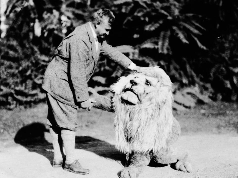 Hugo Bezdek shakes hands with the Nittany Lion