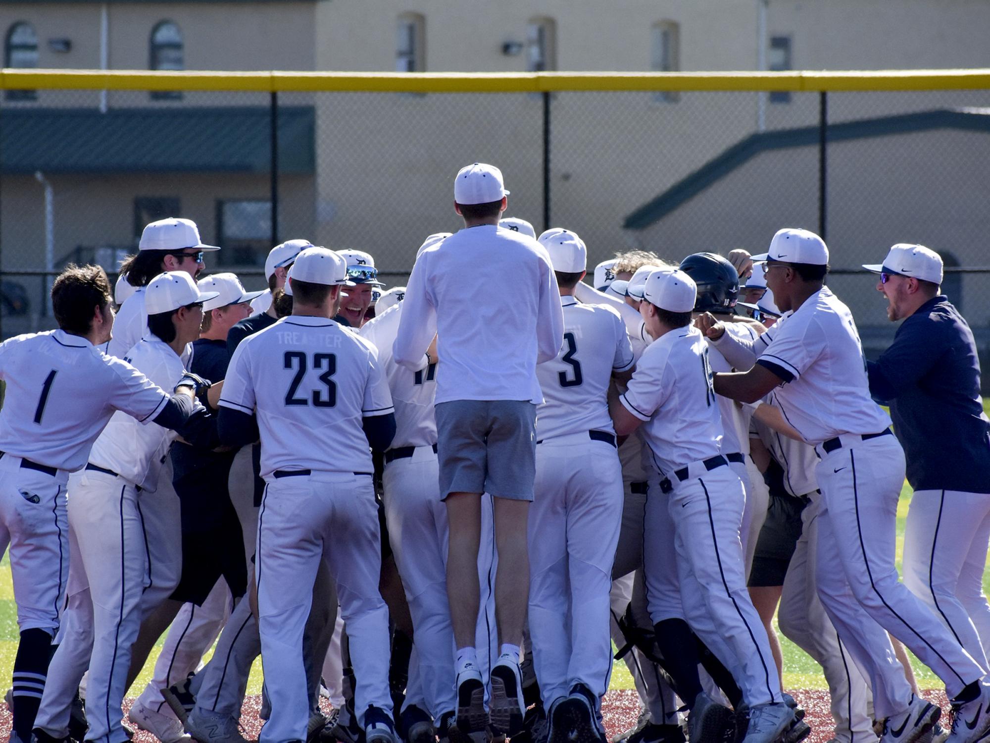 The Penn State DuBois baseball team celebrates a walk off win against Houghton College