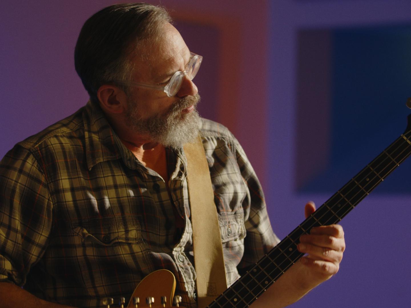 Craig Newschaffer plays the guitar