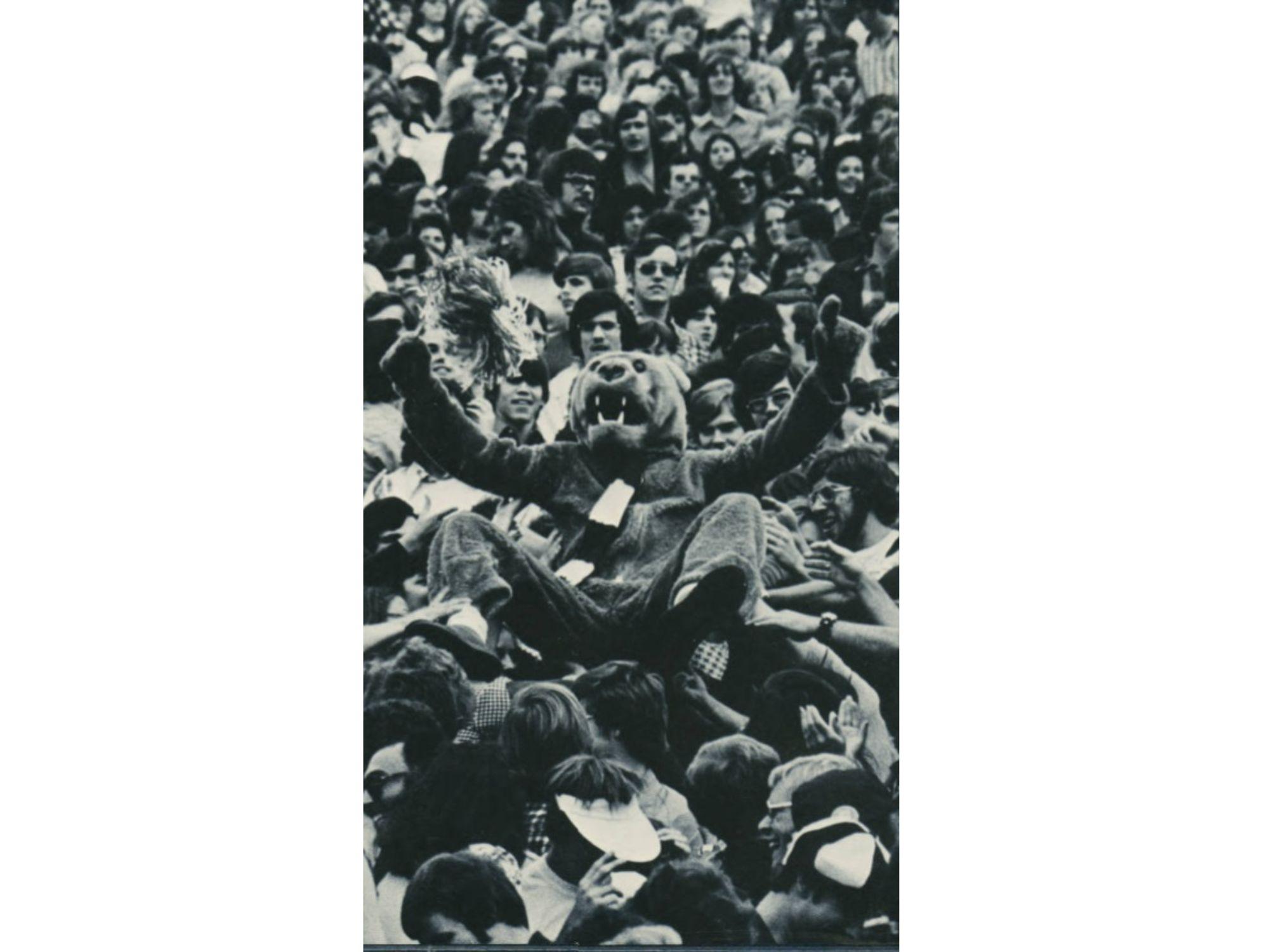 The Nittany Lion surfs through the crowd at a football game