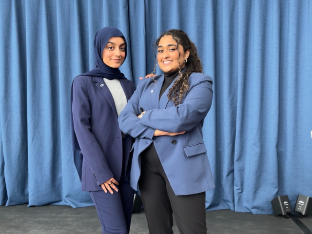 Sabiha Kermalli and Huda Khan standing on stage