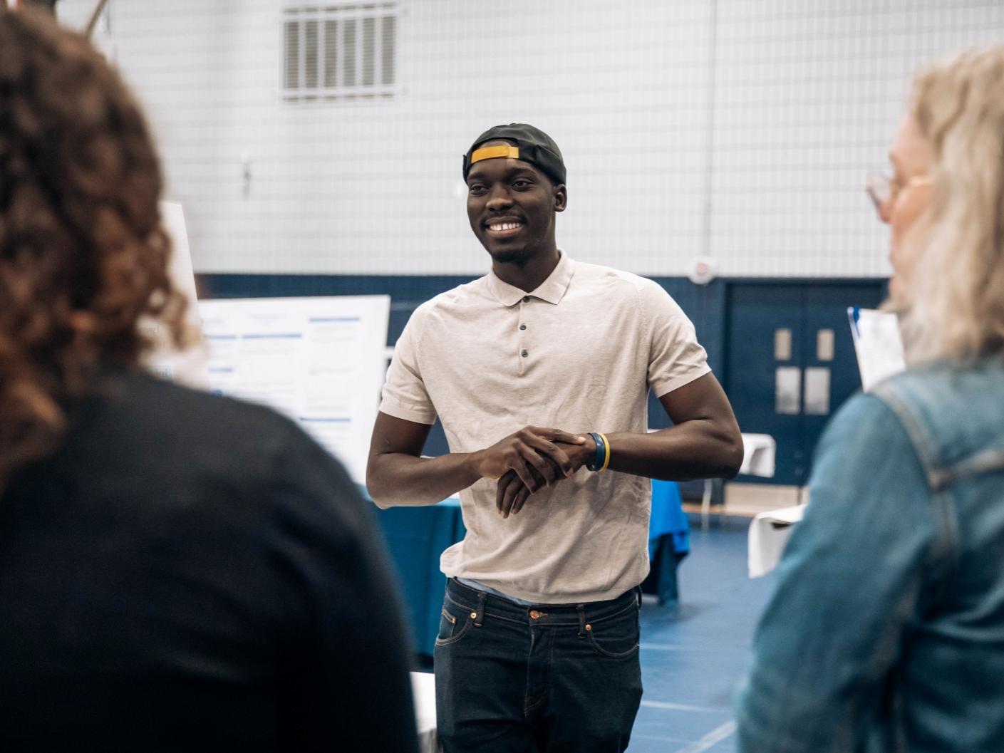 Student smiles at research fair