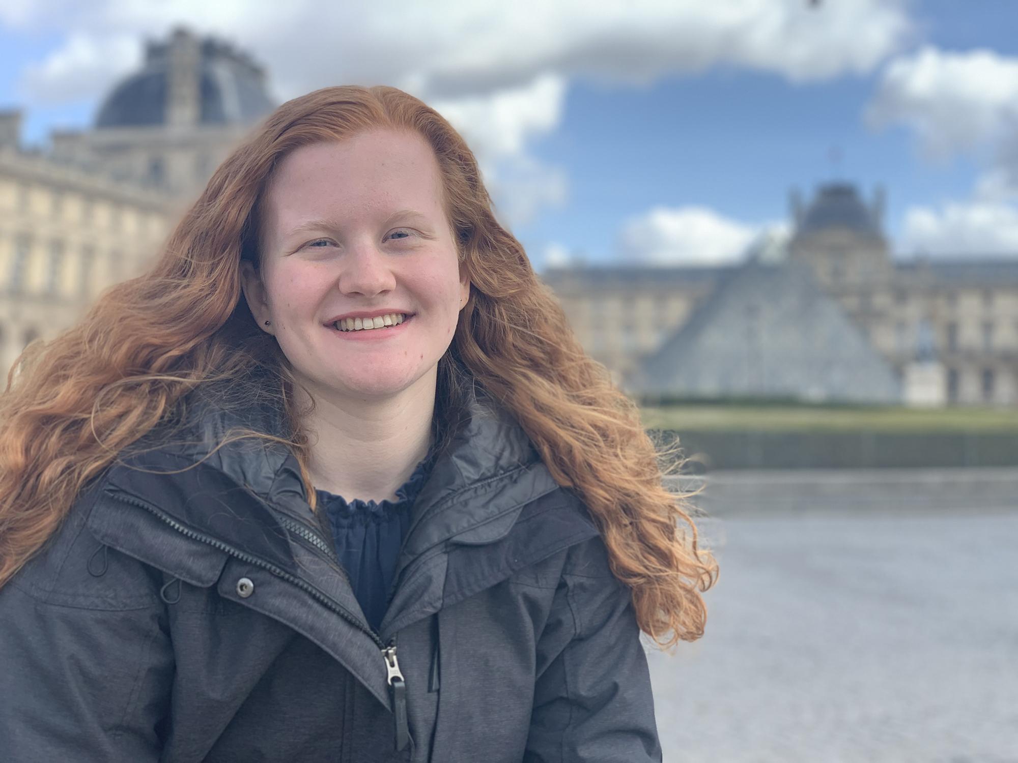 Casey Sennett in front of the Louvre Museum in Paris, France, for embedded course FR/JST 197: France and the Holocaust (March 2019)