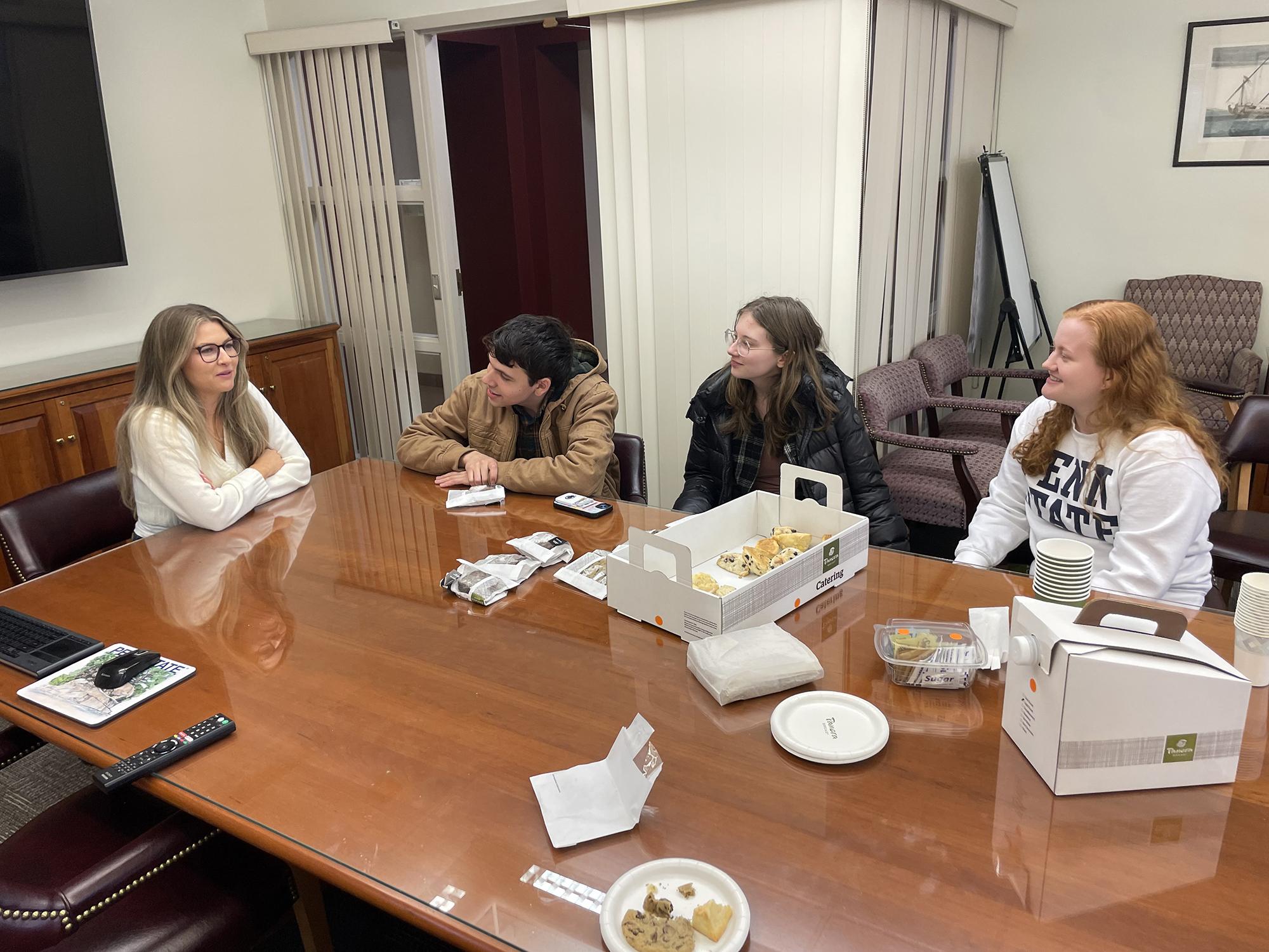 Rachel Storey sits to the left of three other liberal arts students.