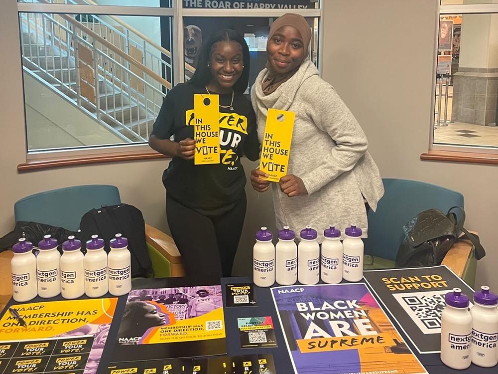 Genesis Severino-Ellis (left) and Fatim Diaby (right) during a fall 2022 voter registration event organized by the NAACP and held in the Paul Robeson Cultural Center.