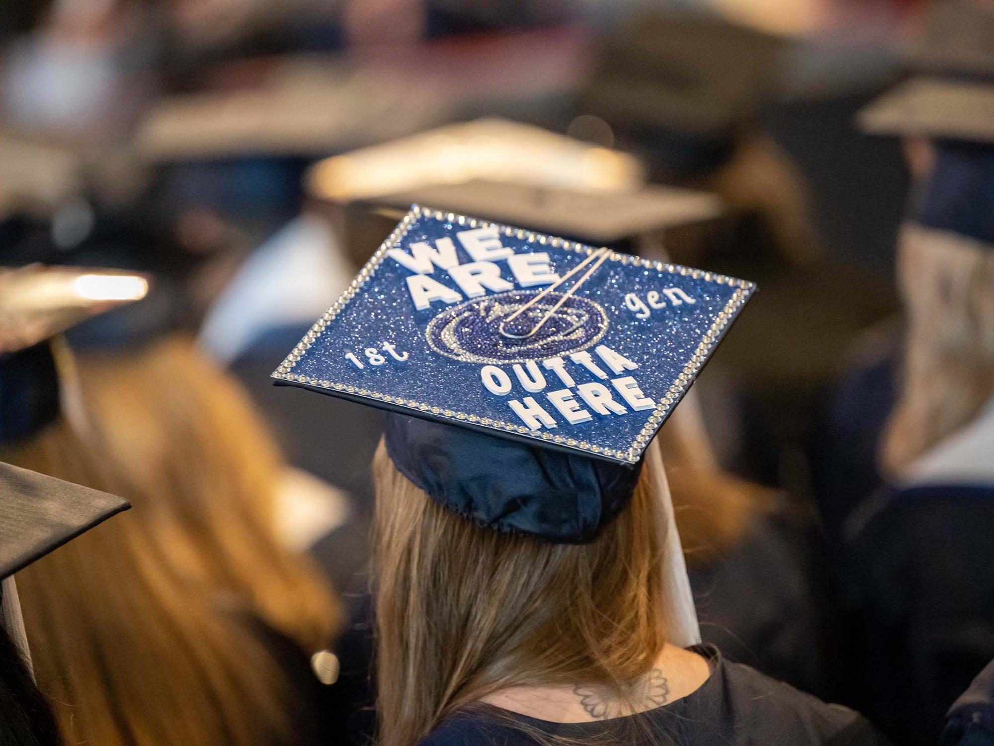 A student shows off her mortarboard cap during Penn State Behrend's spring 2023 commencement ceremony.