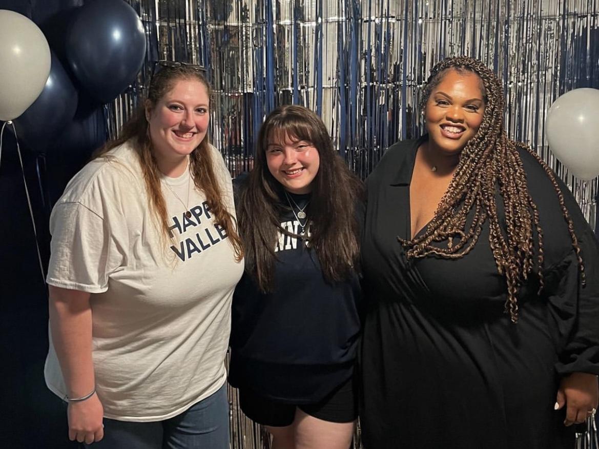 Three members of the World Campus service sorority Delta Gamma Chi pose for a photo