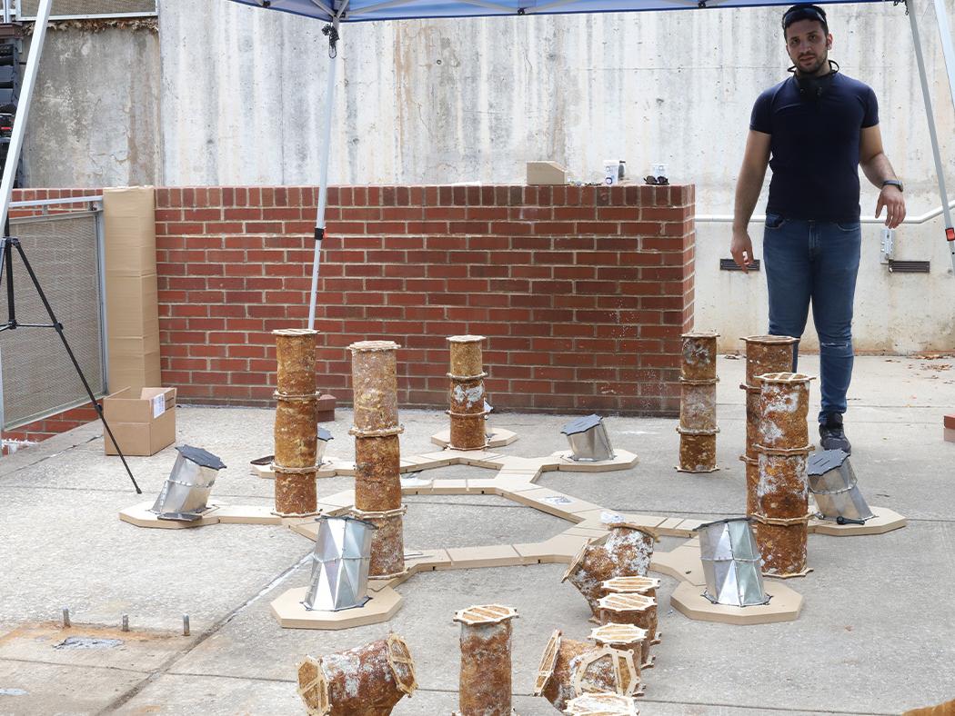 Ali Ghazvinian is shown with the start of the installation of the original MycoCreate structure.