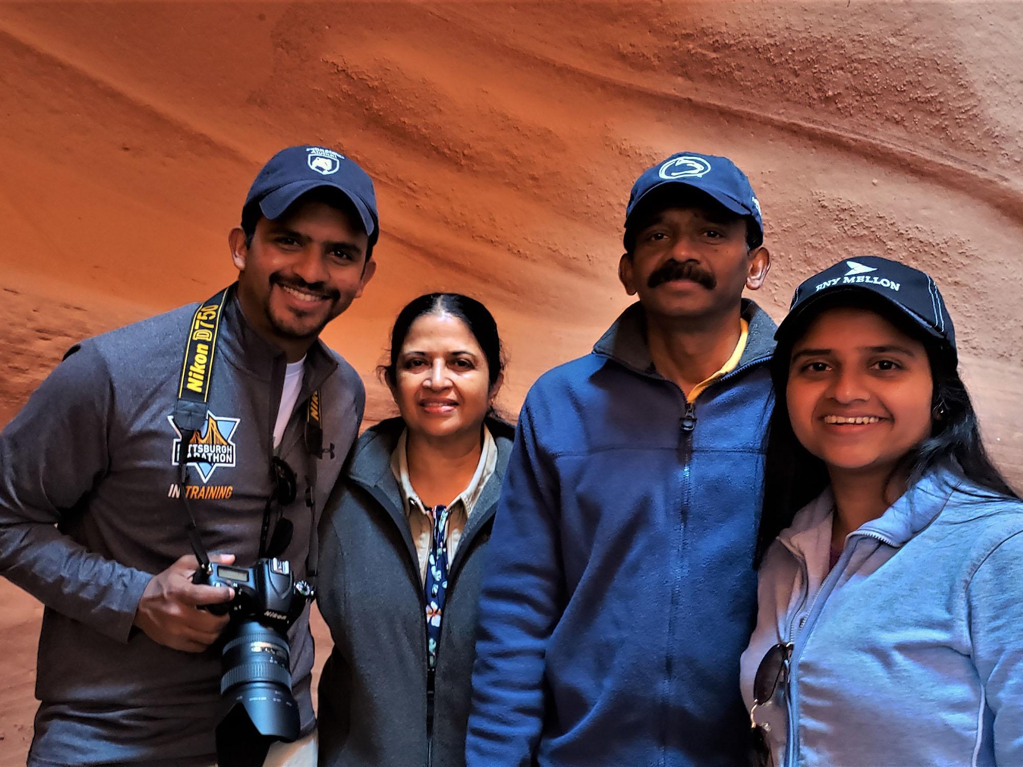Pavara Ranatunga stands with his mother, his ather and his sister.