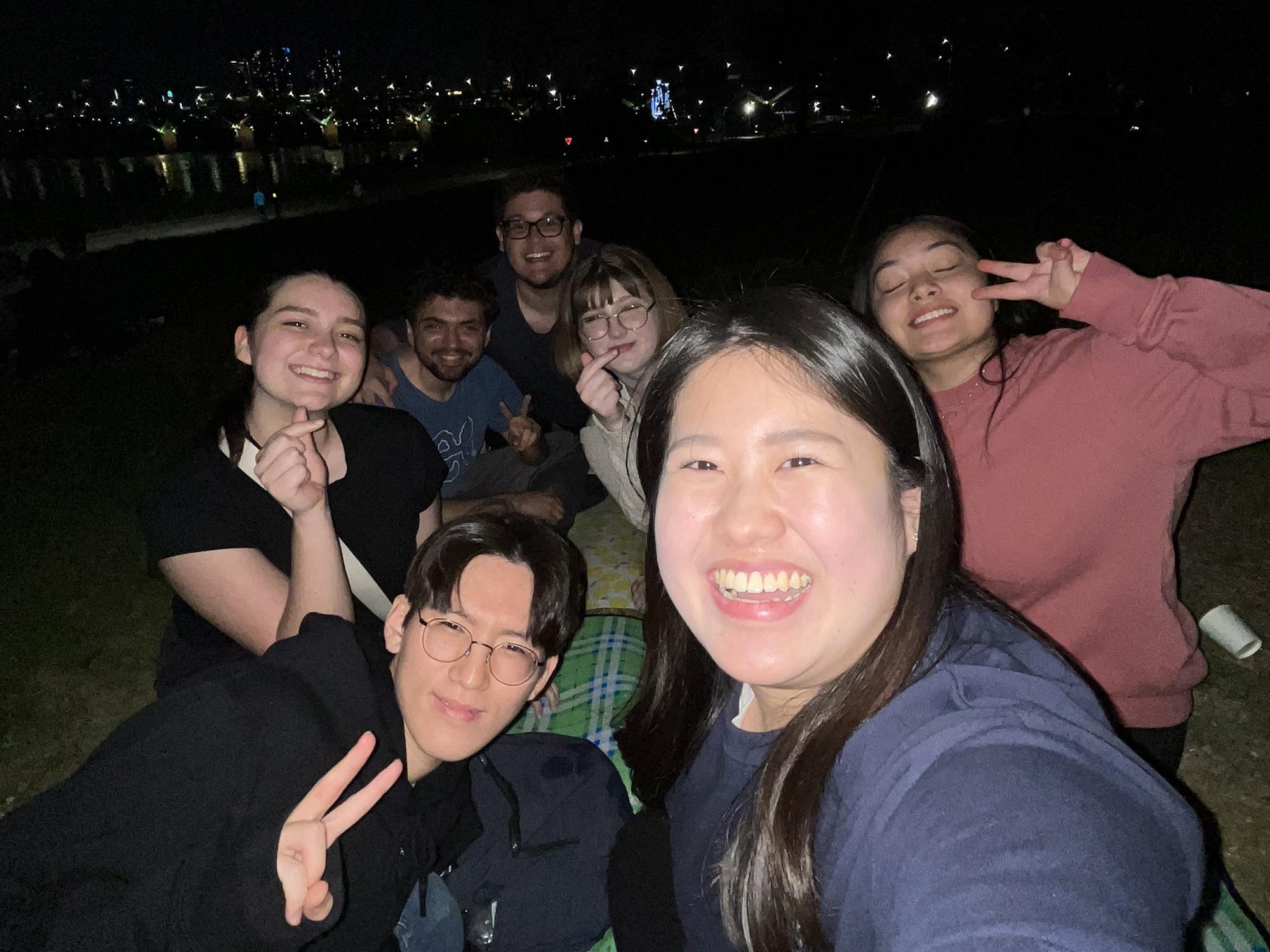 Alexis Pupo and Connor Eibach with other Penn State and Konkuk students visiting the Han River and celebrating “Chimeak” or “Chicken and Beer.”