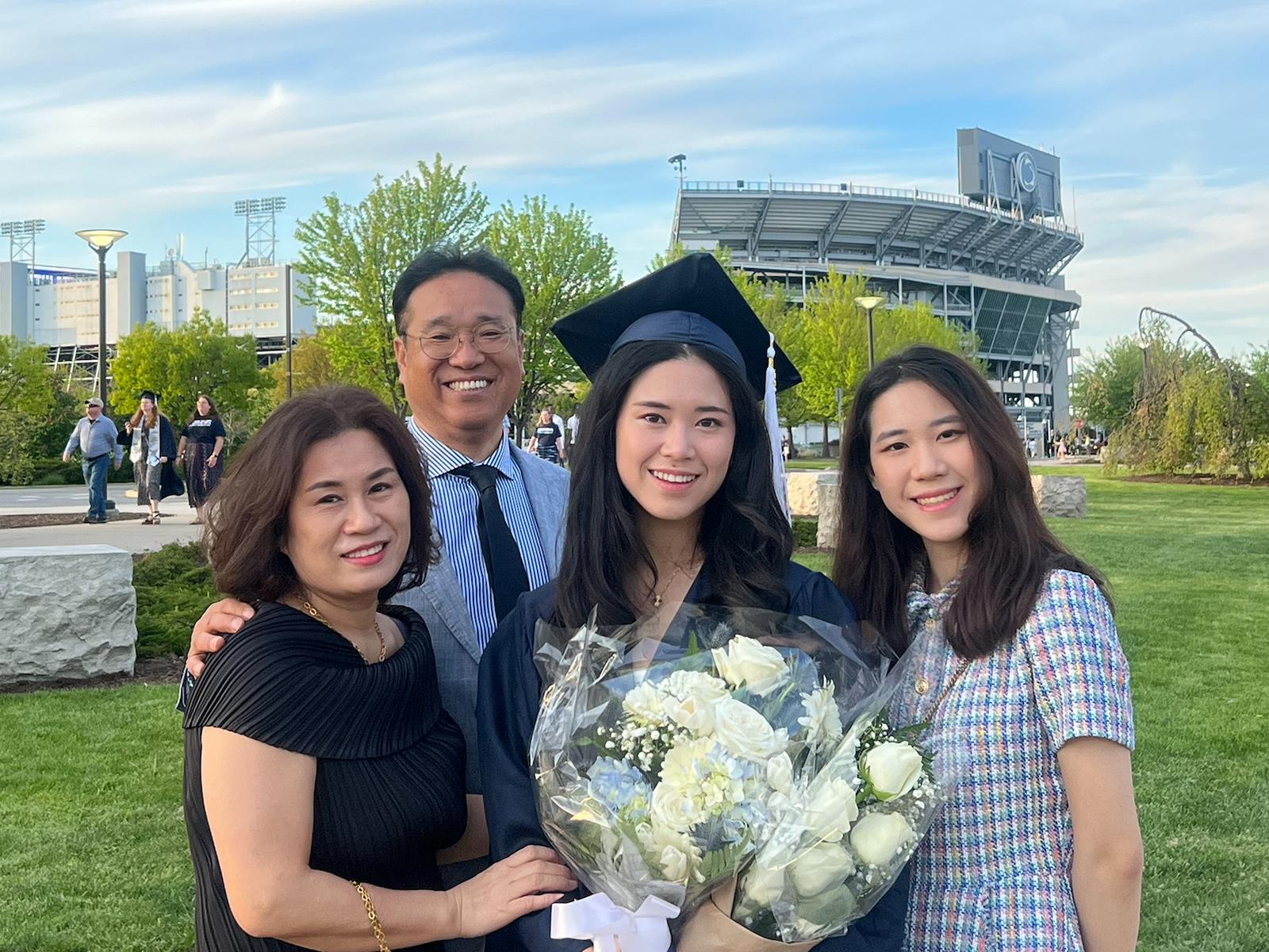 Stella Cho poses with members of her family at commencement 