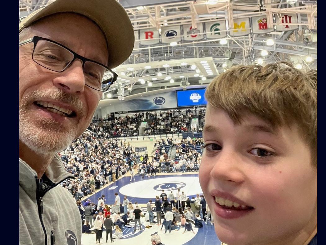Dan Willis at left and his son attend a sporting event at Rec Hall.
