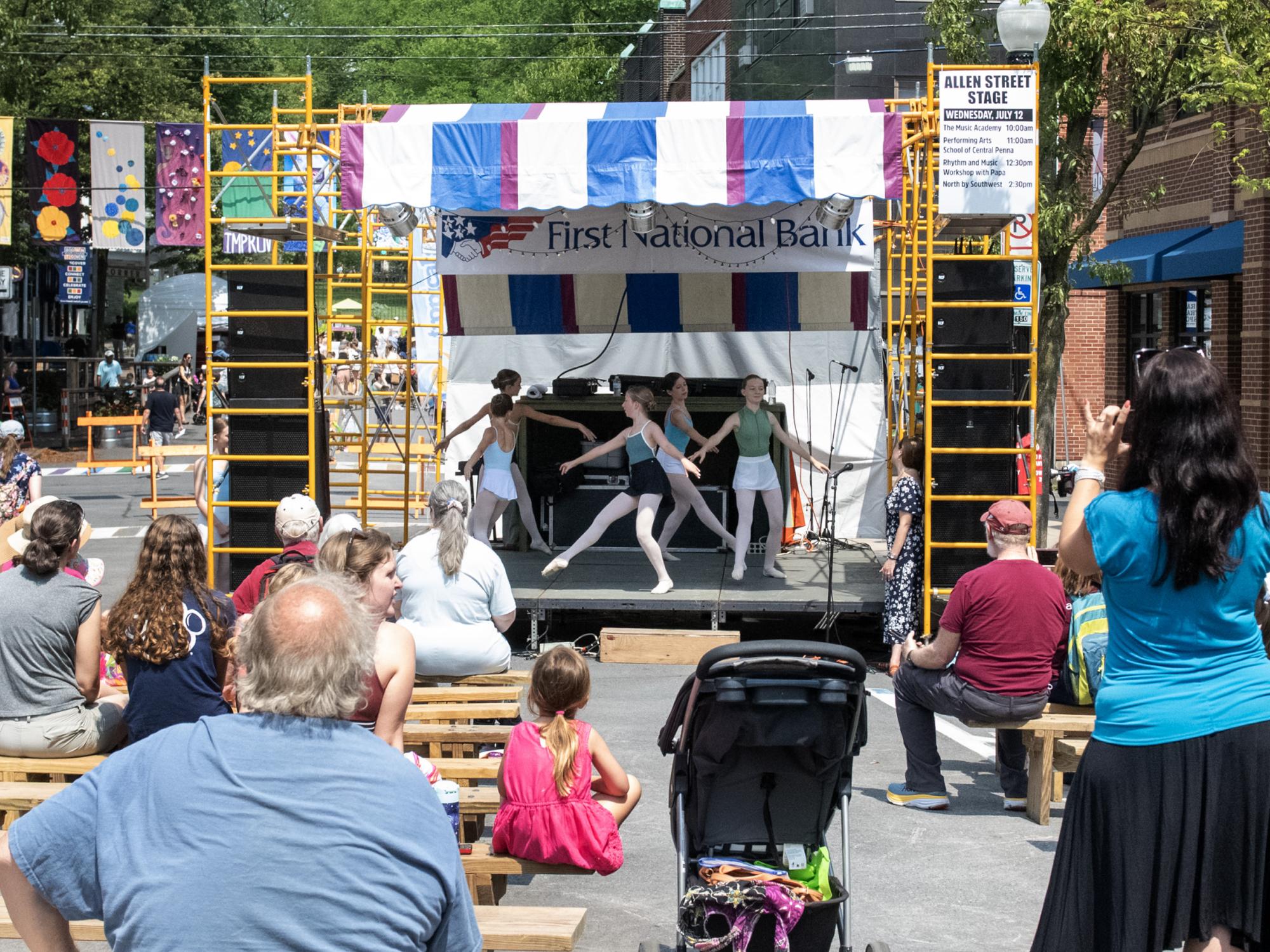 dancers on Allen St stage