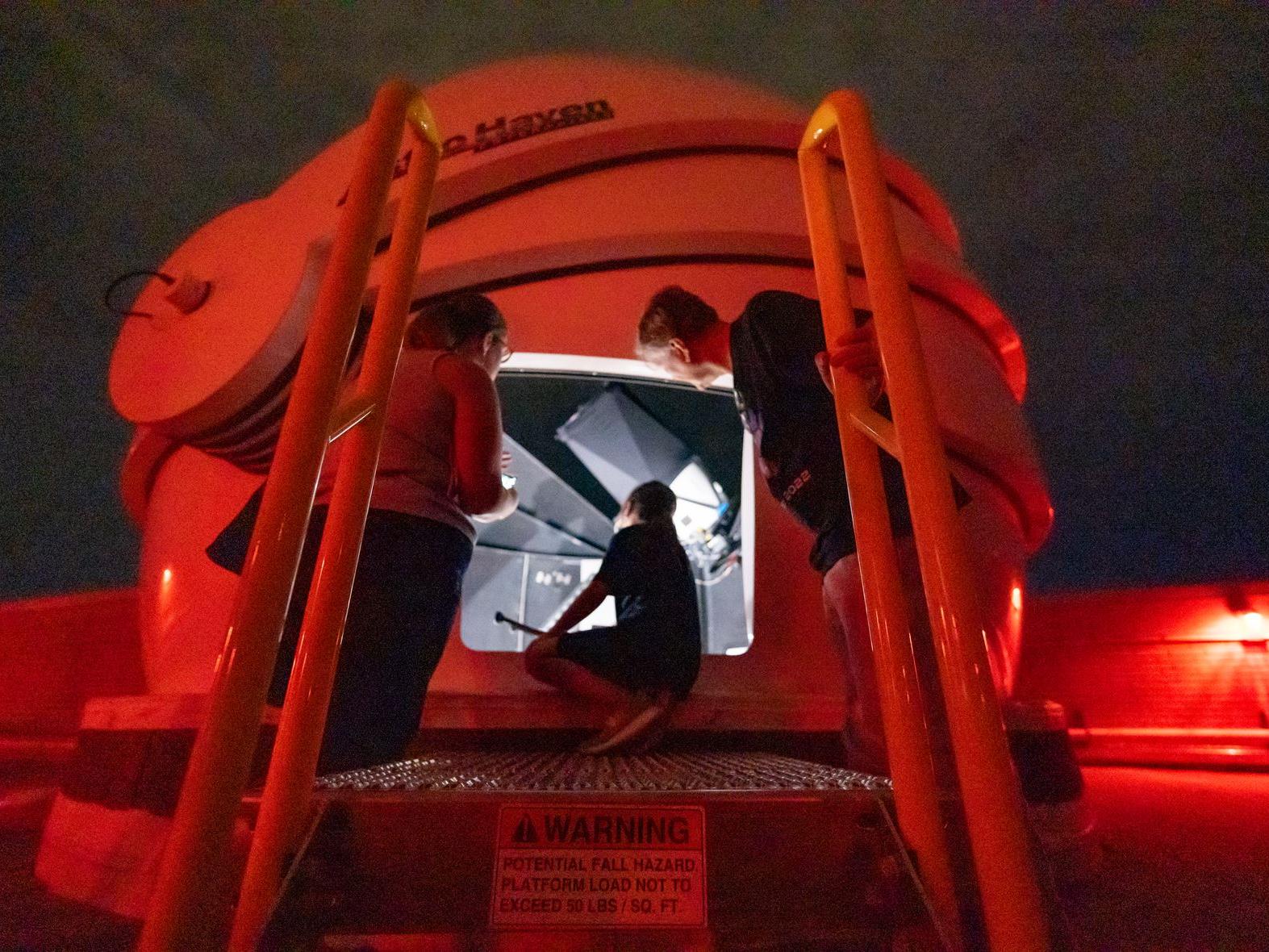 people looking at the Davey rooftop telescopes