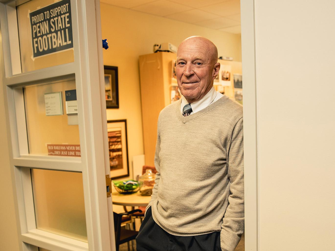 A photo of Bob Novack standing in the door to his office.